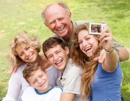 Family outdoors snapping self portrait and enjoying the moment